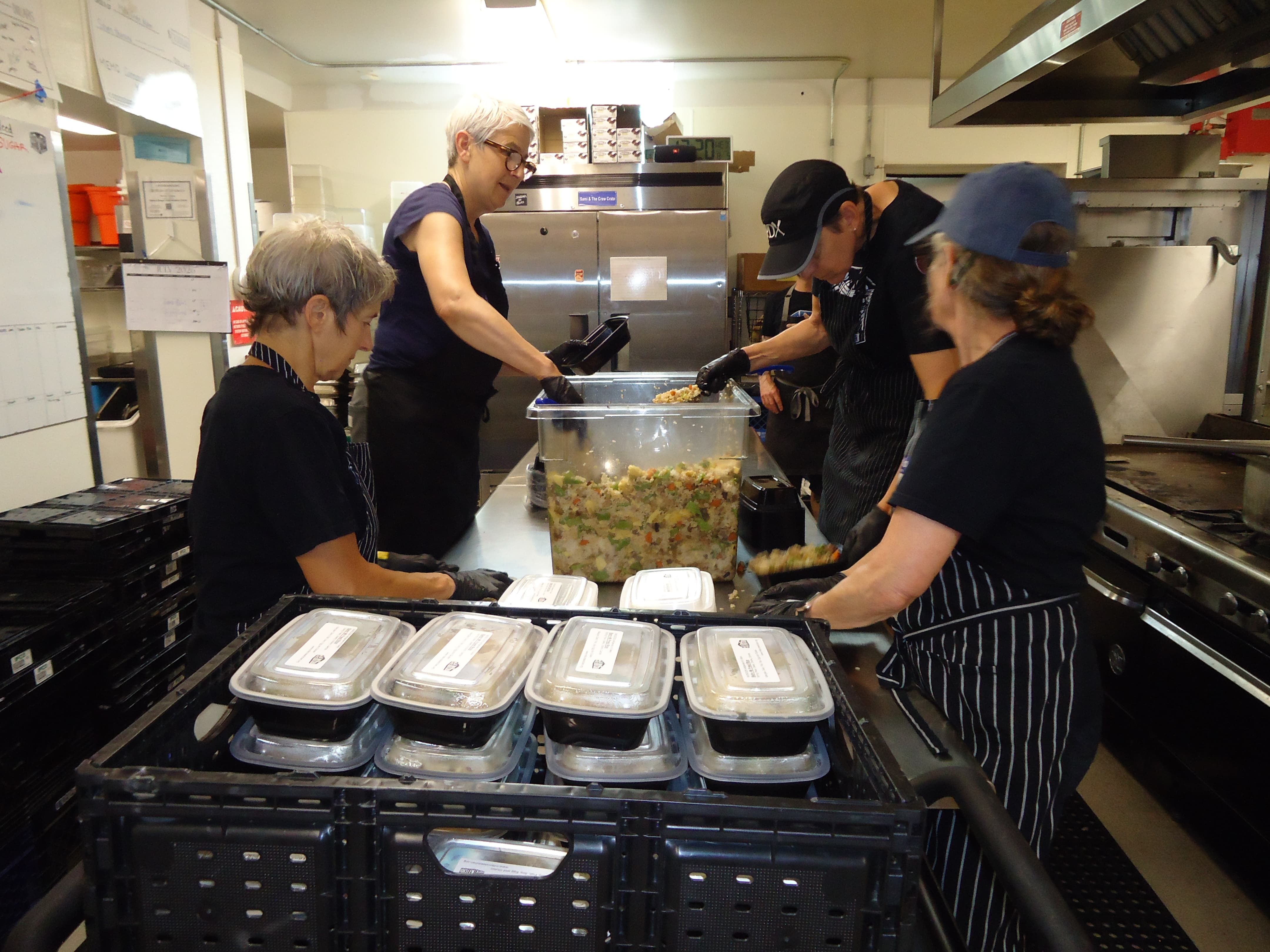 Chef Michael Casper of Milk Crate Kitchen preparing food
