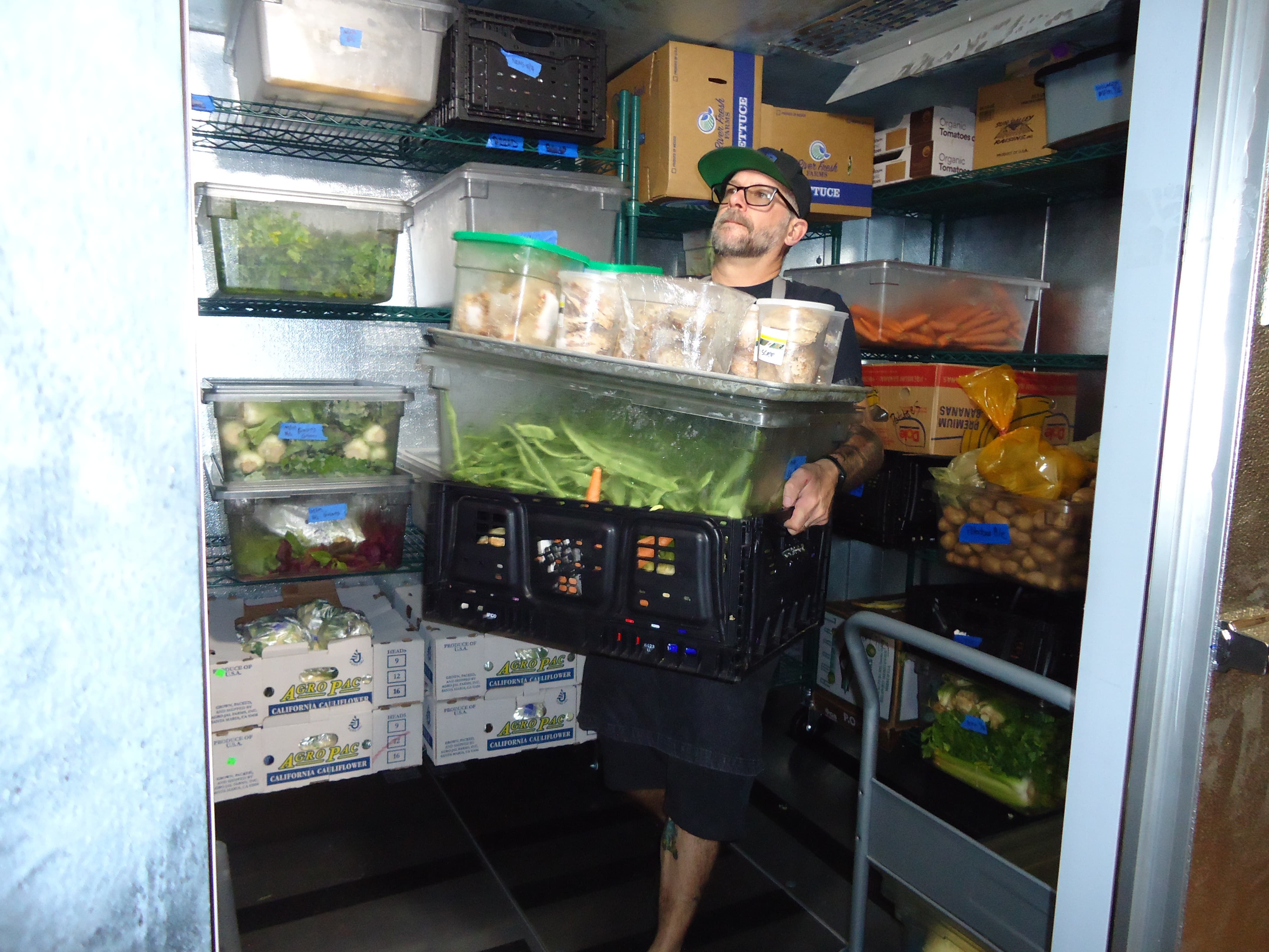 Chef Michael Casper of Milk Crate Kitchen in the walk-in cooler