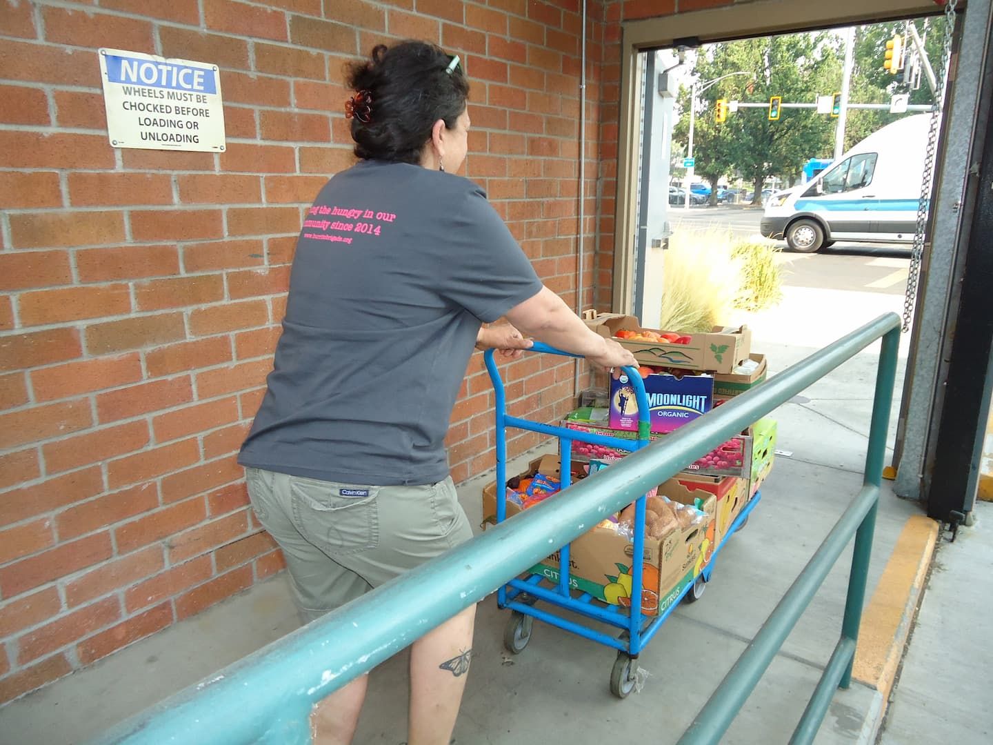 Burrito Brigade team member picking up food